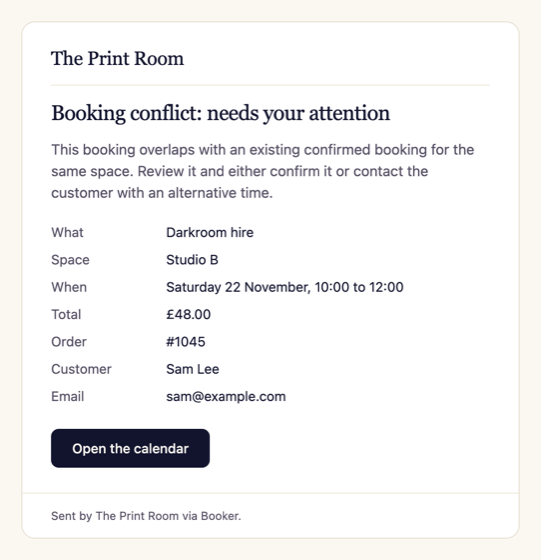 Booking conflict alert email to the merchant